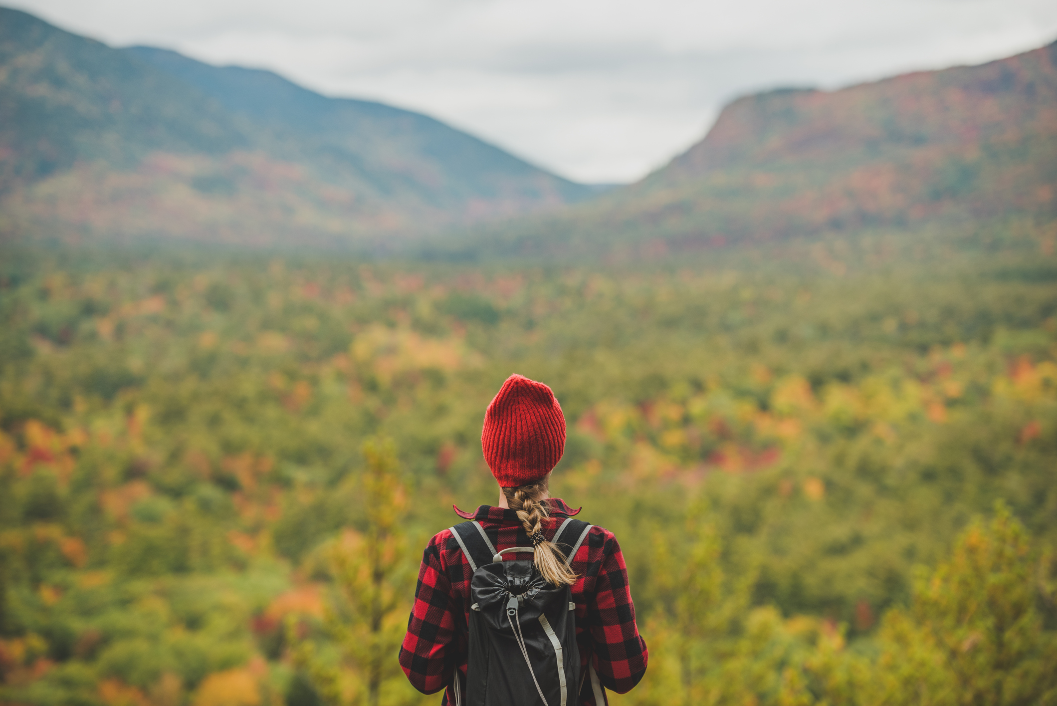 Female hiker surrounded by beautiful fall colors