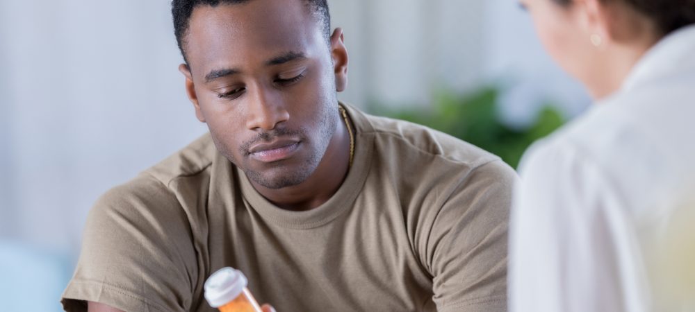 Patient holding their opioid medication