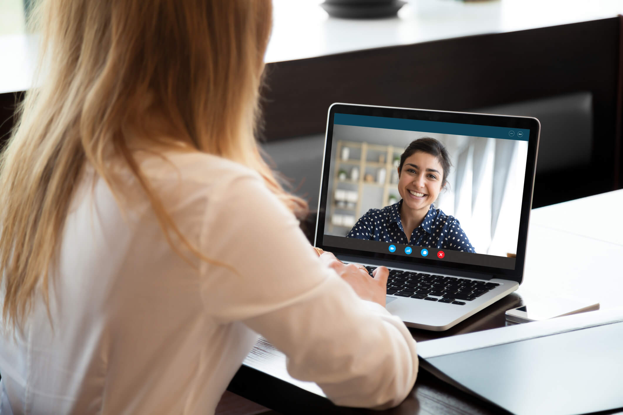 Woman having a video chat with her addiction counselor