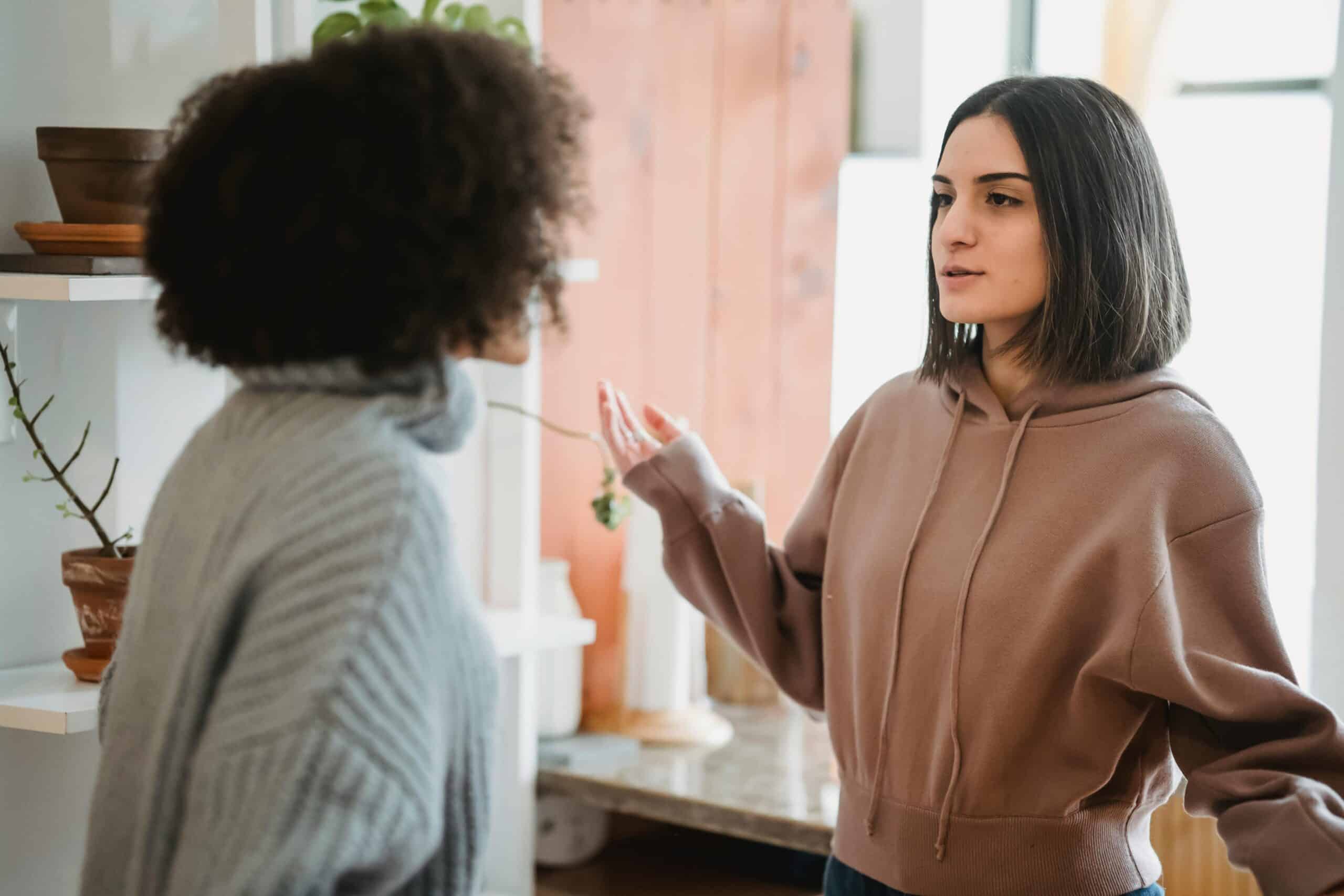 someone helping a woman in denial of addiction